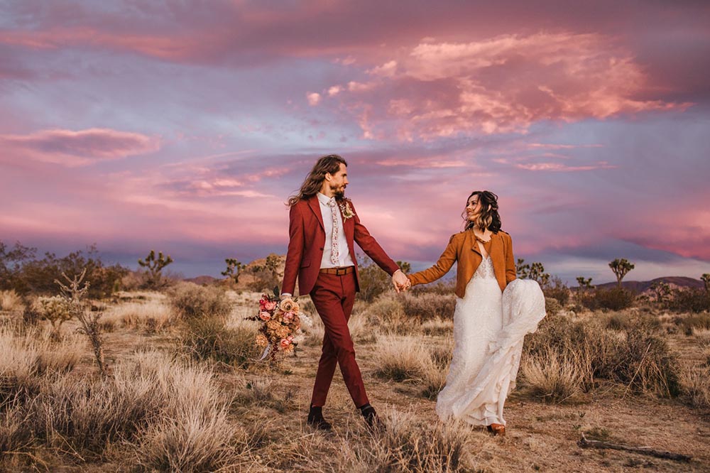 Walking couple at sunset in Joshua Tree National Park